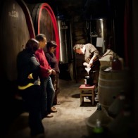 Andrea fills a jug of wine for the waiting customers. Imagine if this was your trip to the liquor store for wine!