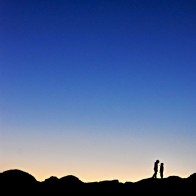 Boys on large rocks in Joshua Tree National Park in Southern California.