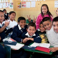 School children in Guatemala pose in their classroom.